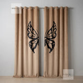 Beige curtains with black butterfly designs on a plain background