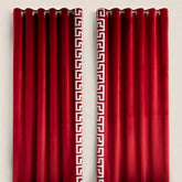 Red curtains with a white geometric pattern on a beige background