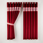 Red curtains with white geometric patterns on a white background