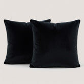 Two purple pillows on a white background