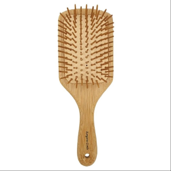 Wooden hairbrush with bristle design on a white background