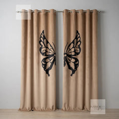 Beige curtains with black butterfly designs on a plain background