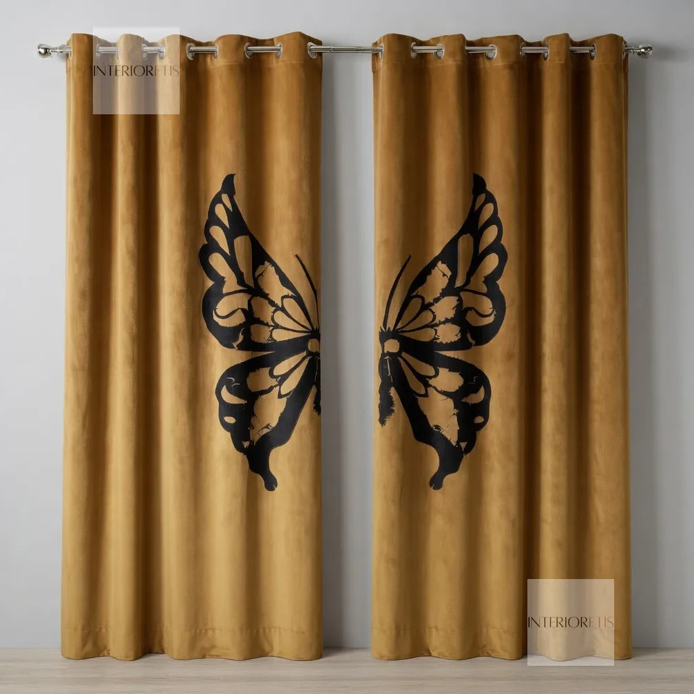 Pair of mustard yellow curtains with black butterfly designs on a gray background.