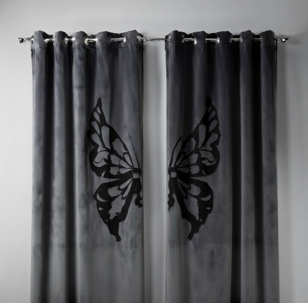 Gray curtains with butterfly cutouts on a plain background