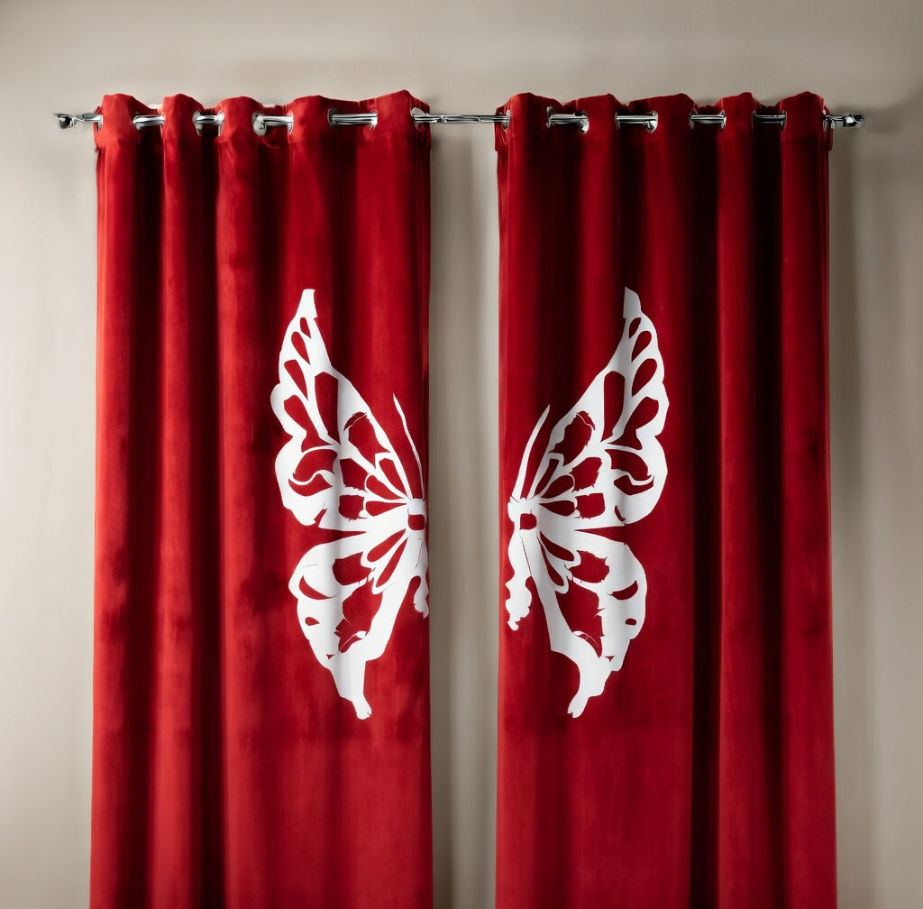 Red curtains with white butterfly designs on a beige wall

