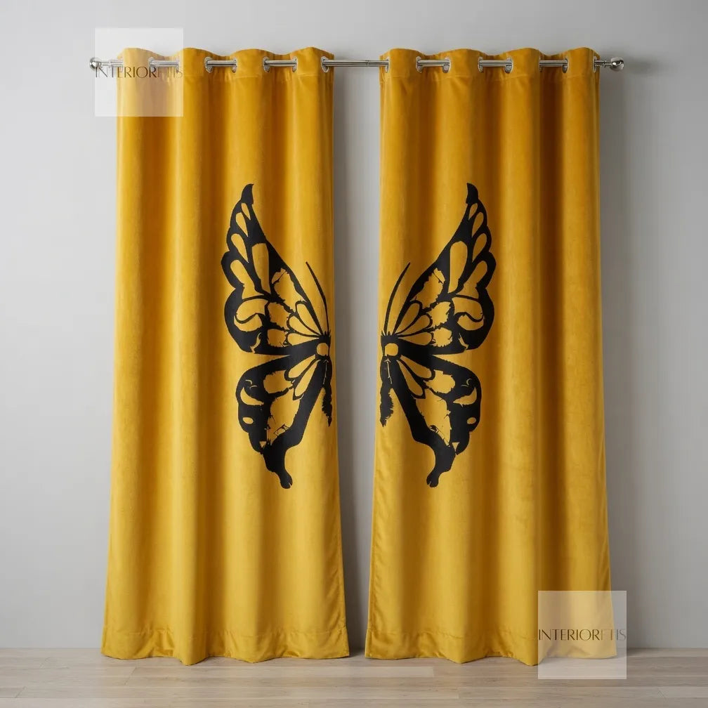 Yellow curtains with black butterfly designs on a gray wall.