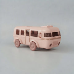 Pink toy bus on a light gray background