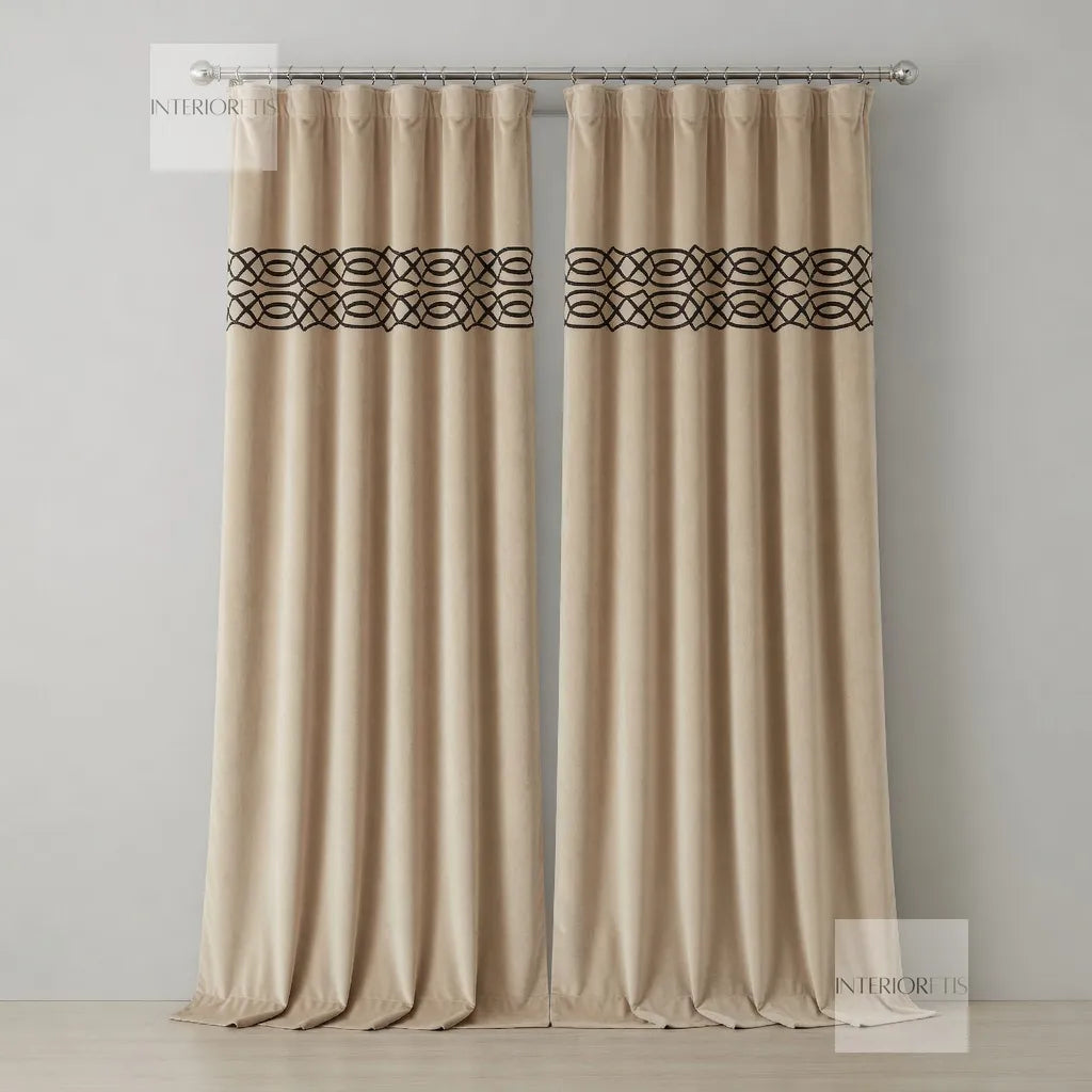 Pair of beige curtains with decorative black bands on a gray background