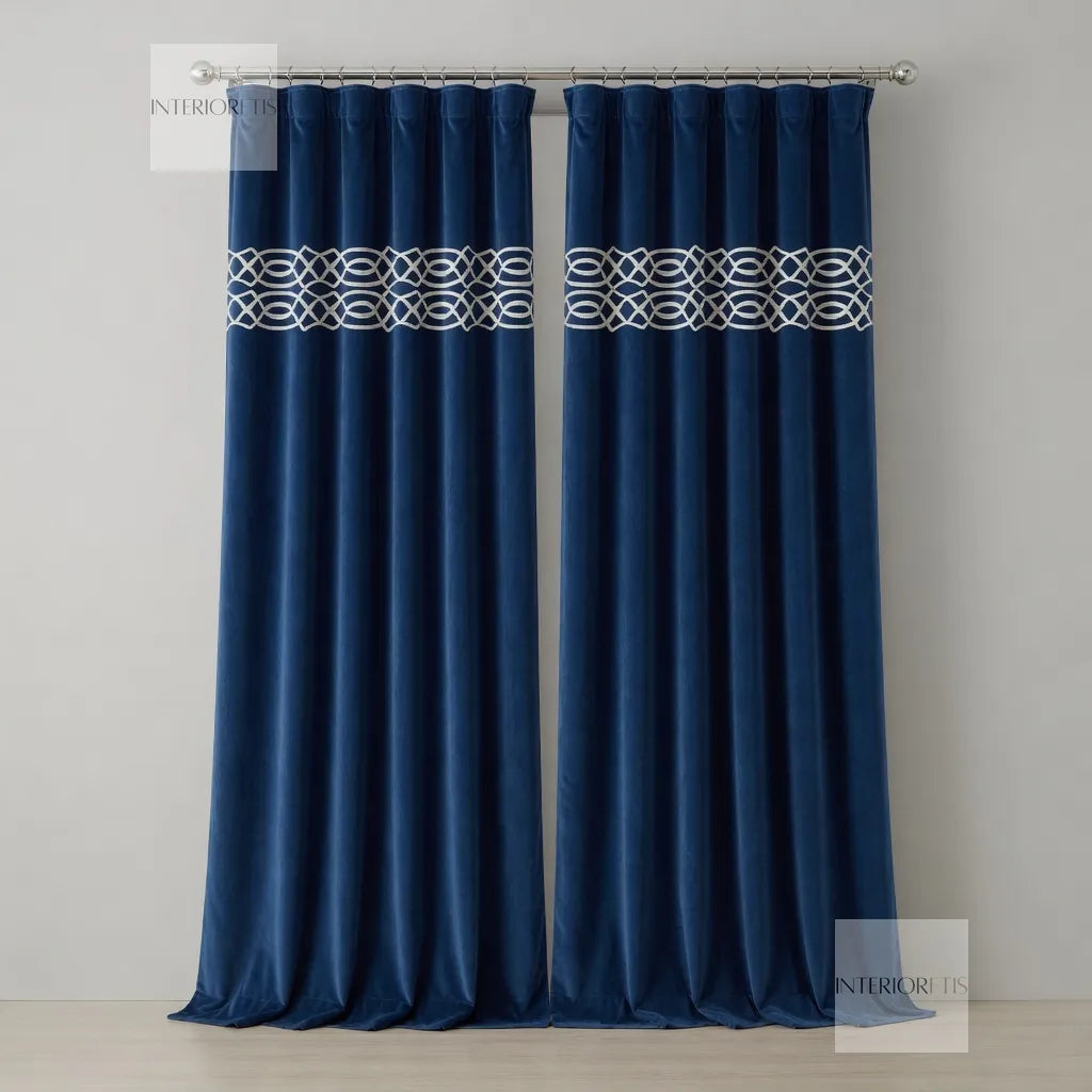 Pair of navy blue curtains with a white geometric pattern on a gray background