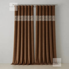 Brown curtains with decorative band on a plain background