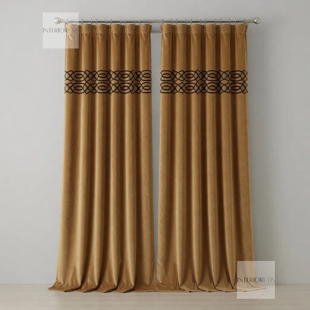 Pair of gold curtains with decorative top panel on a gray background