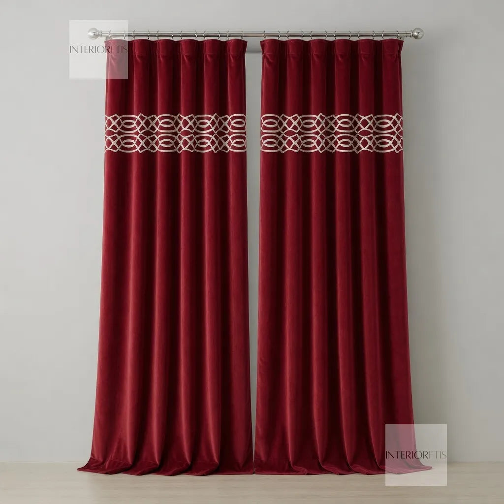 Pair of red curtains with a decorative band on a plain background
