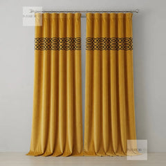 Pair of mustard yellow curtains with decorative top band on a gray background