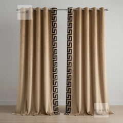 Pair of beige curtains with decorative black patterns on a gray background