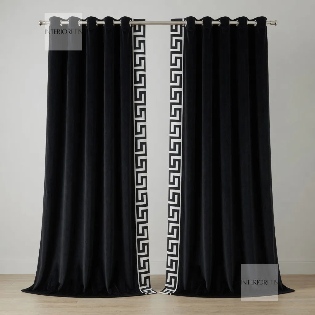 Black curtains with white geometric pattern on a wooden floor and light gray wall background.