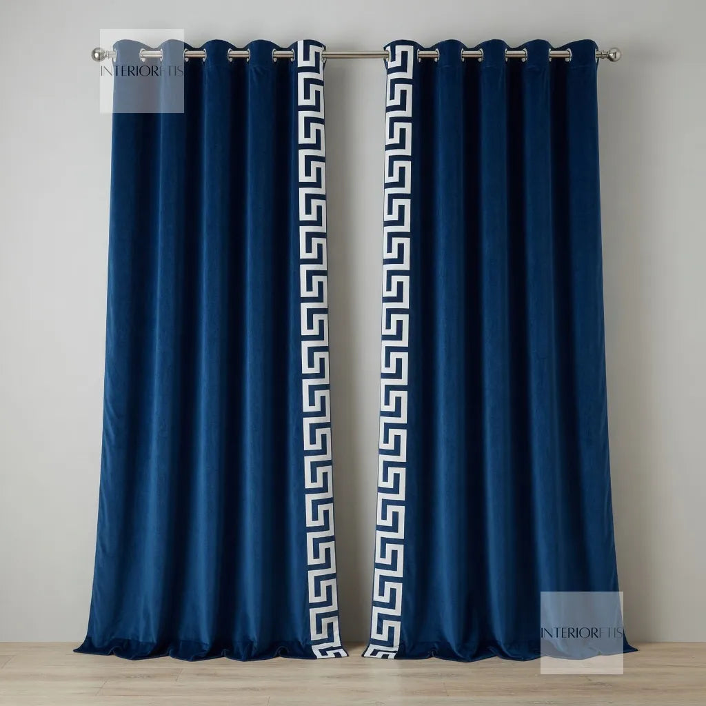 Pair of navy blue curtains with white geometric pattern on a gray background