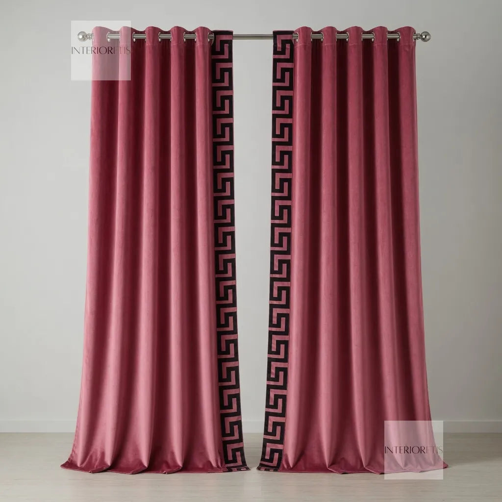 Pair of pink curtains with decorative black patterns on a gray background