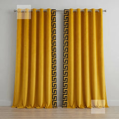 Mustard yellow curtains with black geometric patterns on a white background