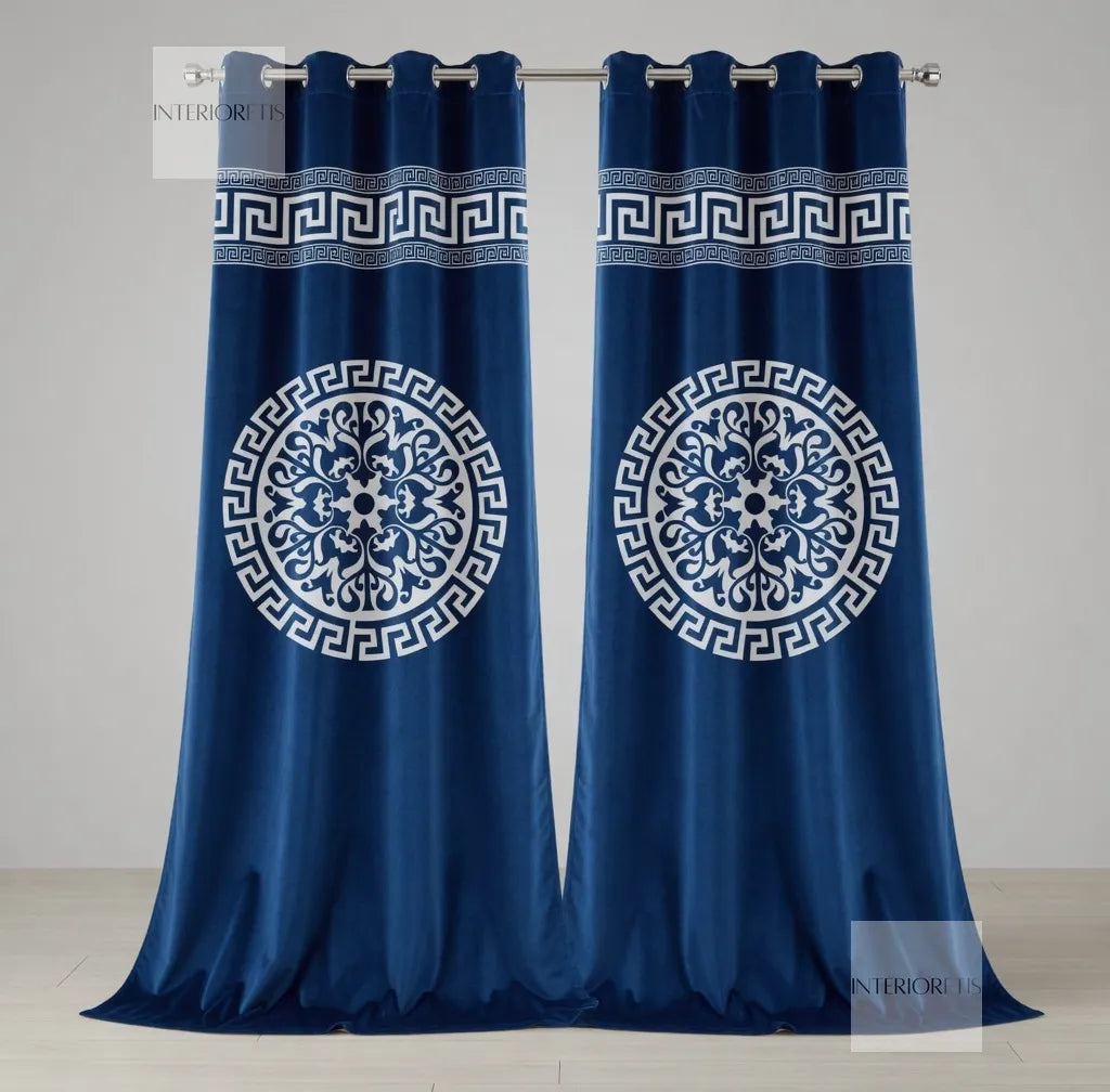 Pair of blue curtains with white geometric patterns on a gray background