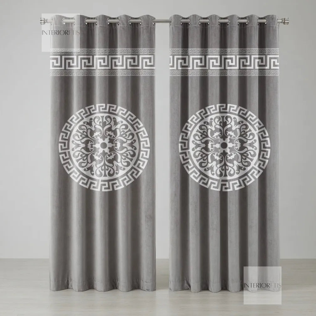 Pair of gray curtains with decorative patterns on a white background