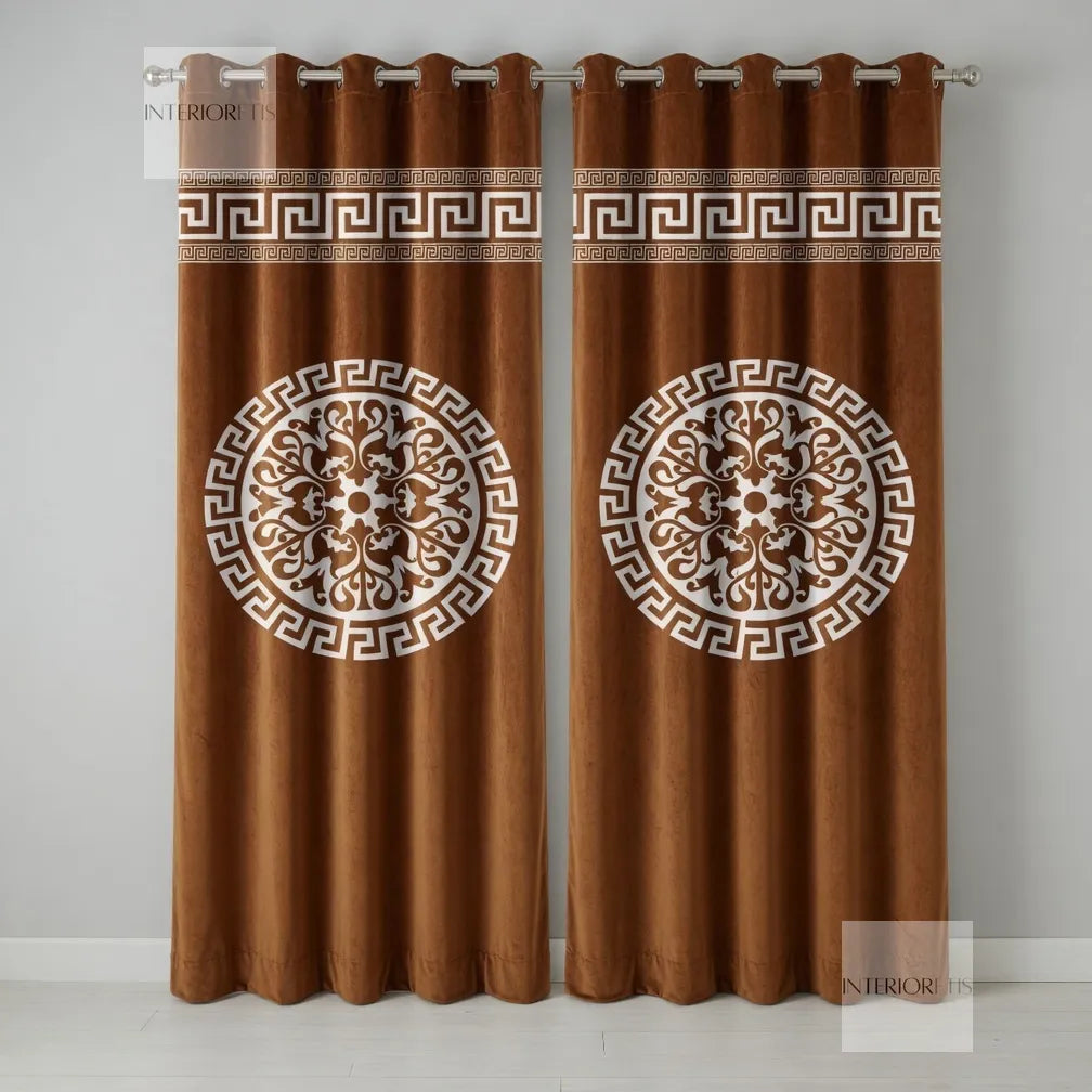 Pair of olive curtains with decorative patterns on a plain background