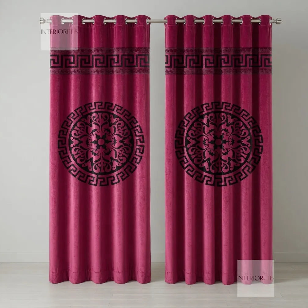 Pair of pink curtains with black geometric patterns on a white background