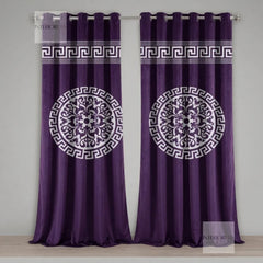 Pair of purple curtains with white decorative patterns on a gray background
