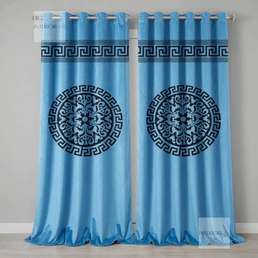 Pair of sky blue curtains with black decorative patterns on a gray background