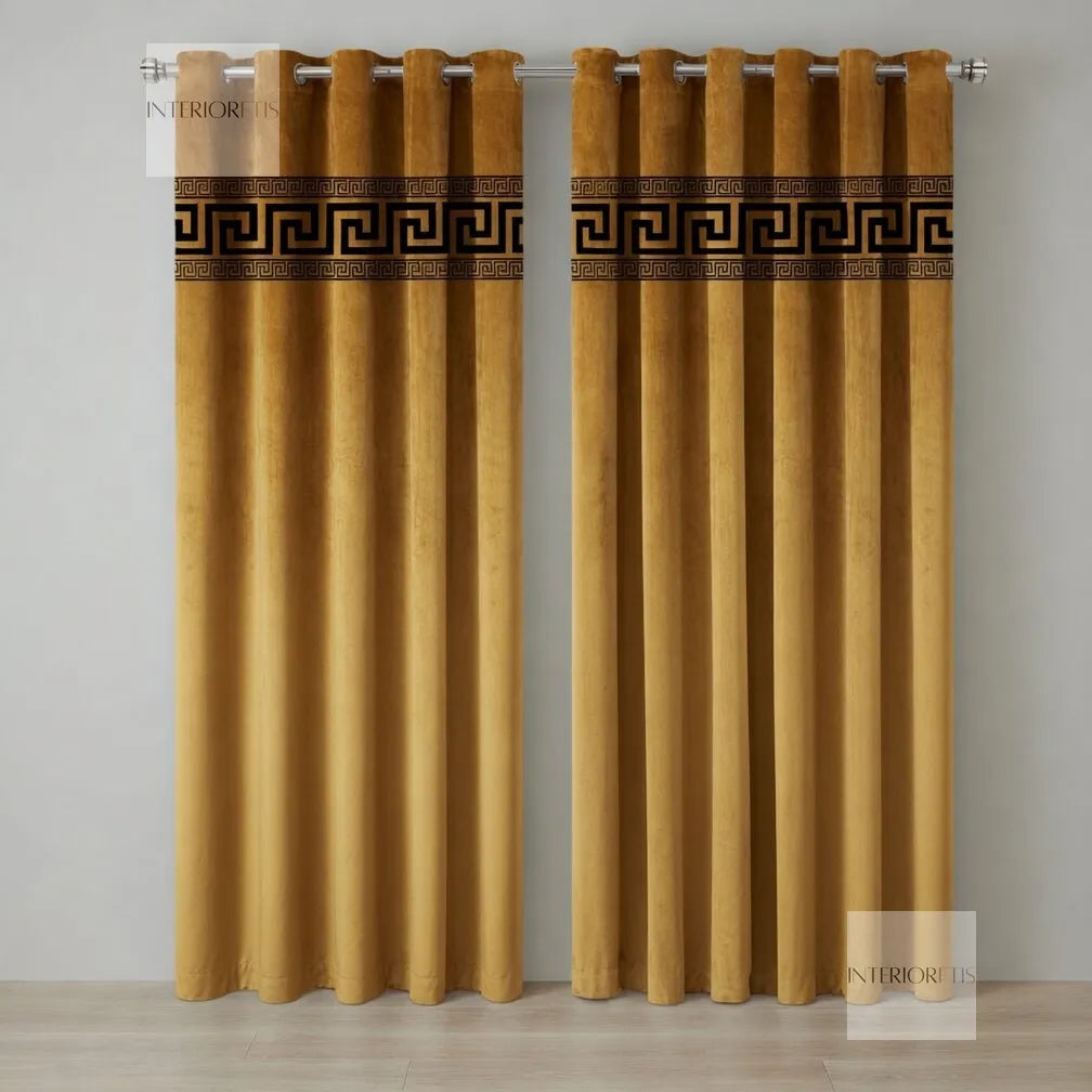 Pair of golden curtains with decorative banding on a gray background