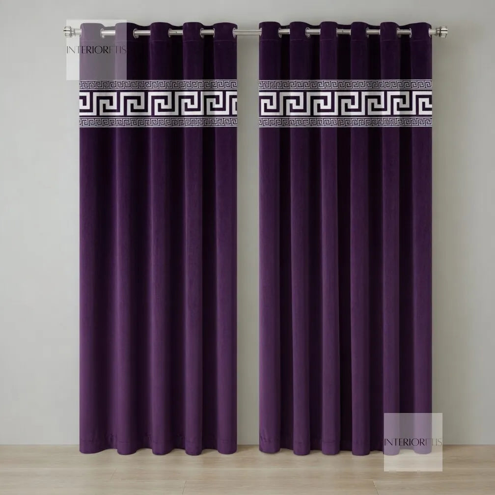 Pair of purple curtains with decorative banding on a neutral background