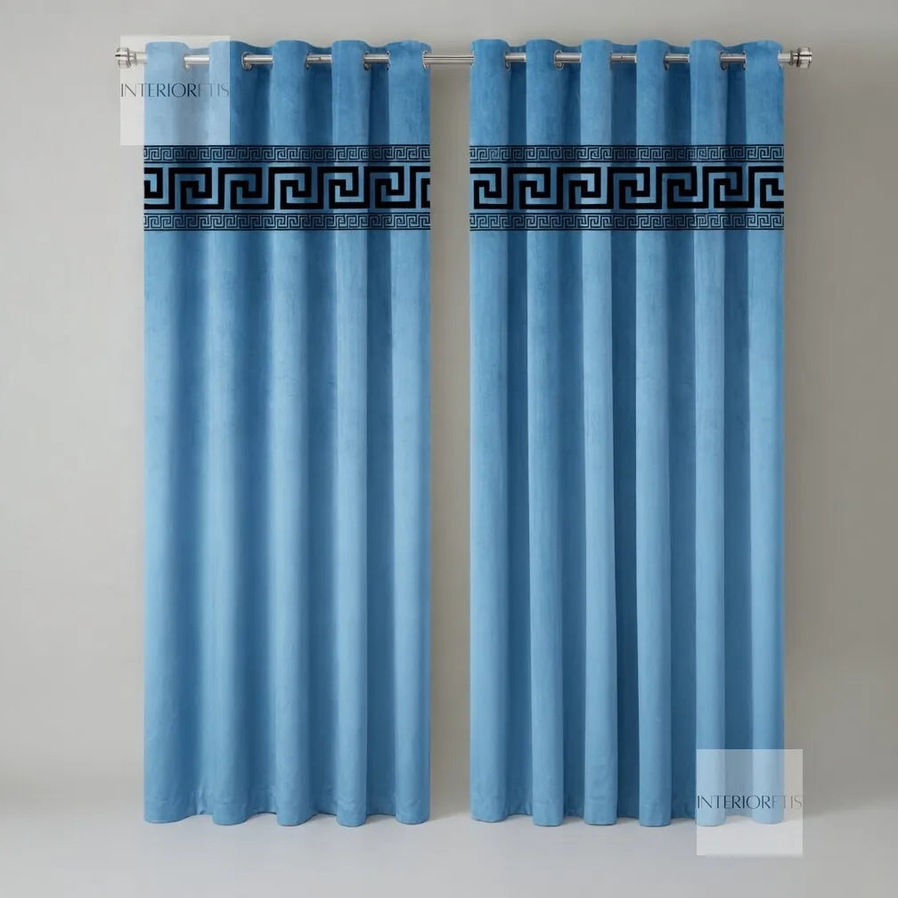 Pair of sky blue curtains with decorative banding on a gray background