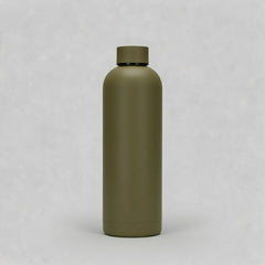 Green water bottle on a light gray background