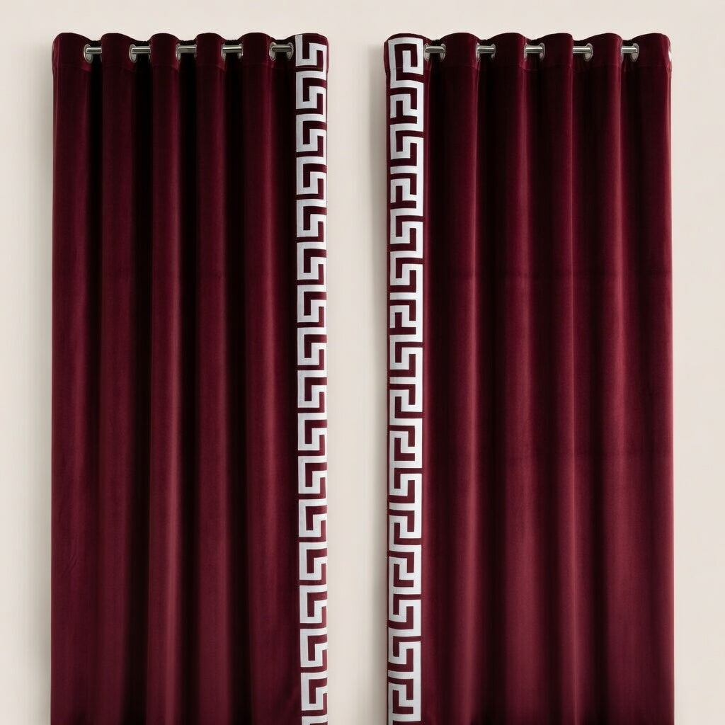 Pair of burgundy curtains with Greek key pattern on a white background