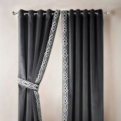 Gray curtains with white geometric patterns on a neutral background