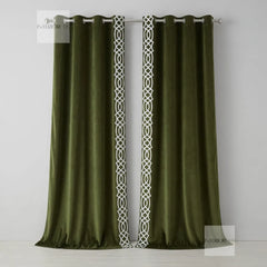 Pair of olive curtains with decorative white trim on a gray background