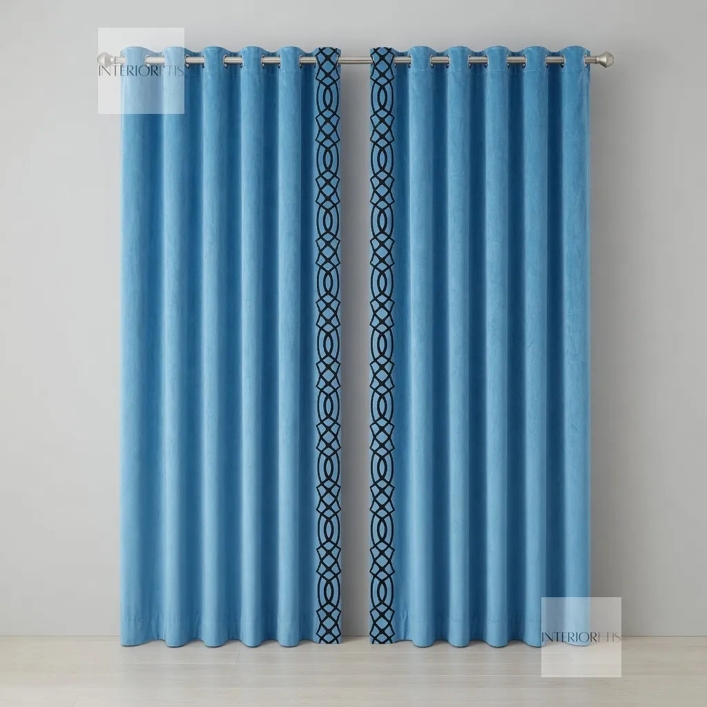 Pair of sky blue curtains with decorative trim on a gray background
