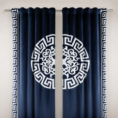 Navy blue curtains with white geometric patterns and border on a gray background