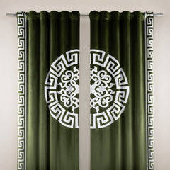 Green curtains with white decorative patterns on a neutral background