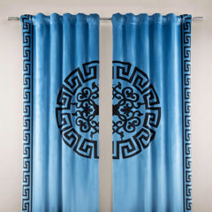 Blue curtains with black decorative patterns on a white background
