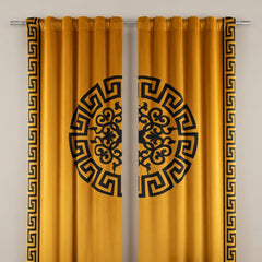 Mustard yellow curtains with black decorative patterns on a gray background