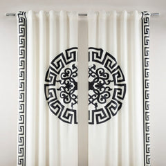 White curtains with black decorative patterns on a white background