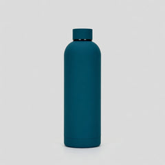 Teal water bottle on a light gray background
