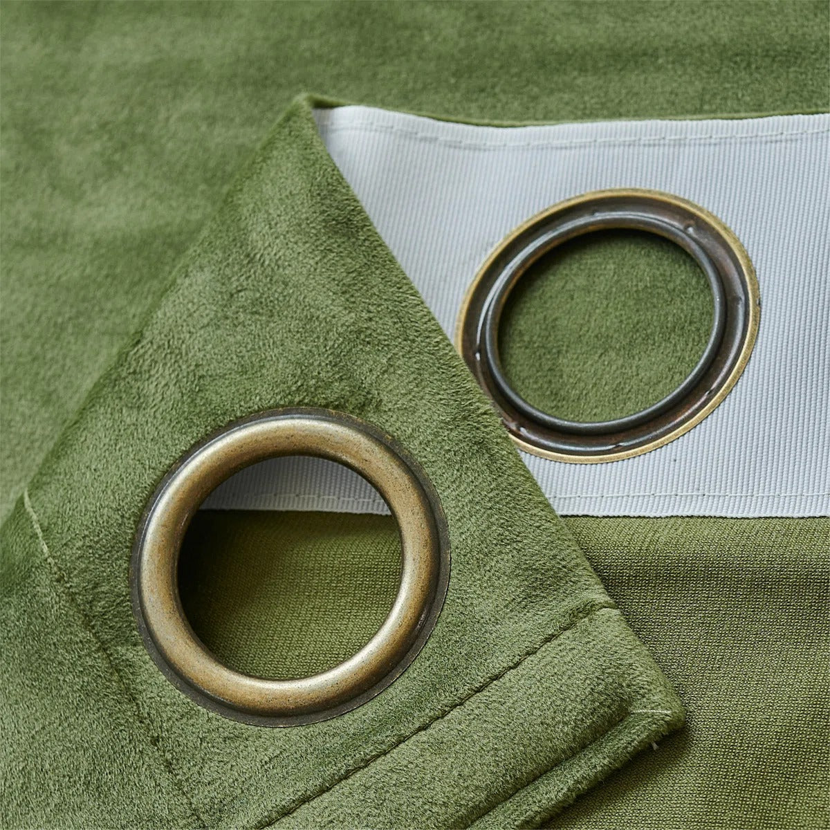 Close-up of soft olive green velvet curtain fabric