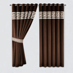 Brown curtains with decorative white bands on a plain background