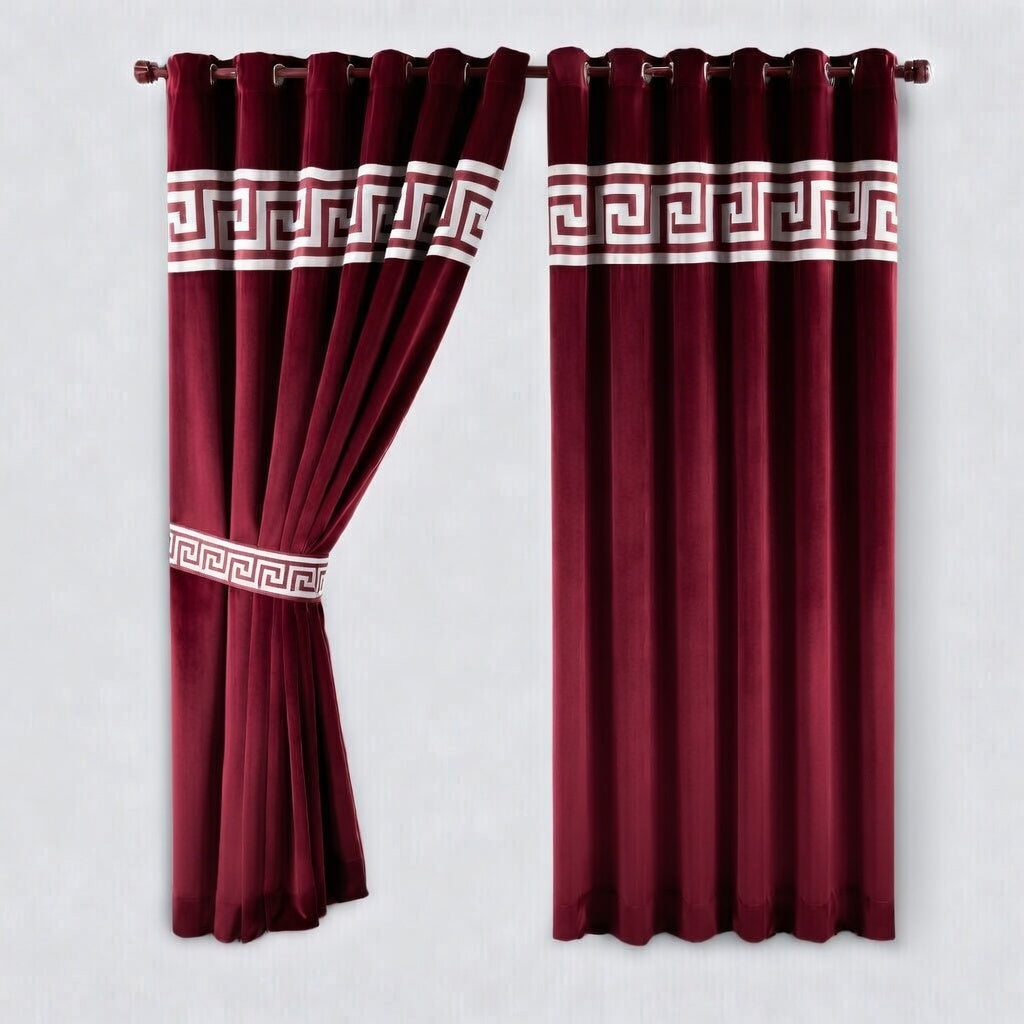 Pair of red curtains with white decorative patterns on a light gray background