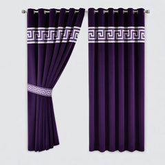 Pair of purple curtains with white decorative bands on a light gray background